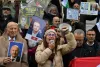 Tunisians rally for political prisoners' release on uprising anniversary